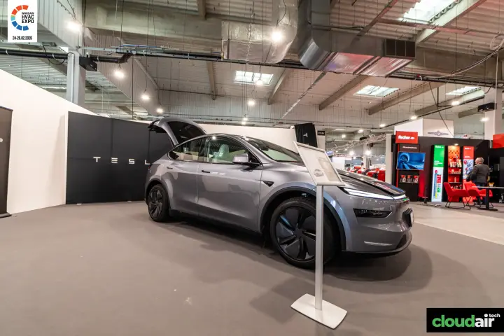 Front view of the Tesla car with an information board