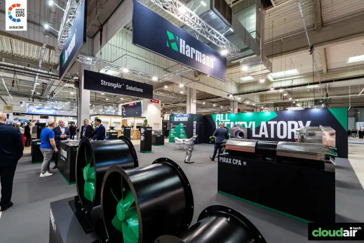Harmann axial fans with green impellers and suspended brand banners at Warsaw HVAC Expo 2026