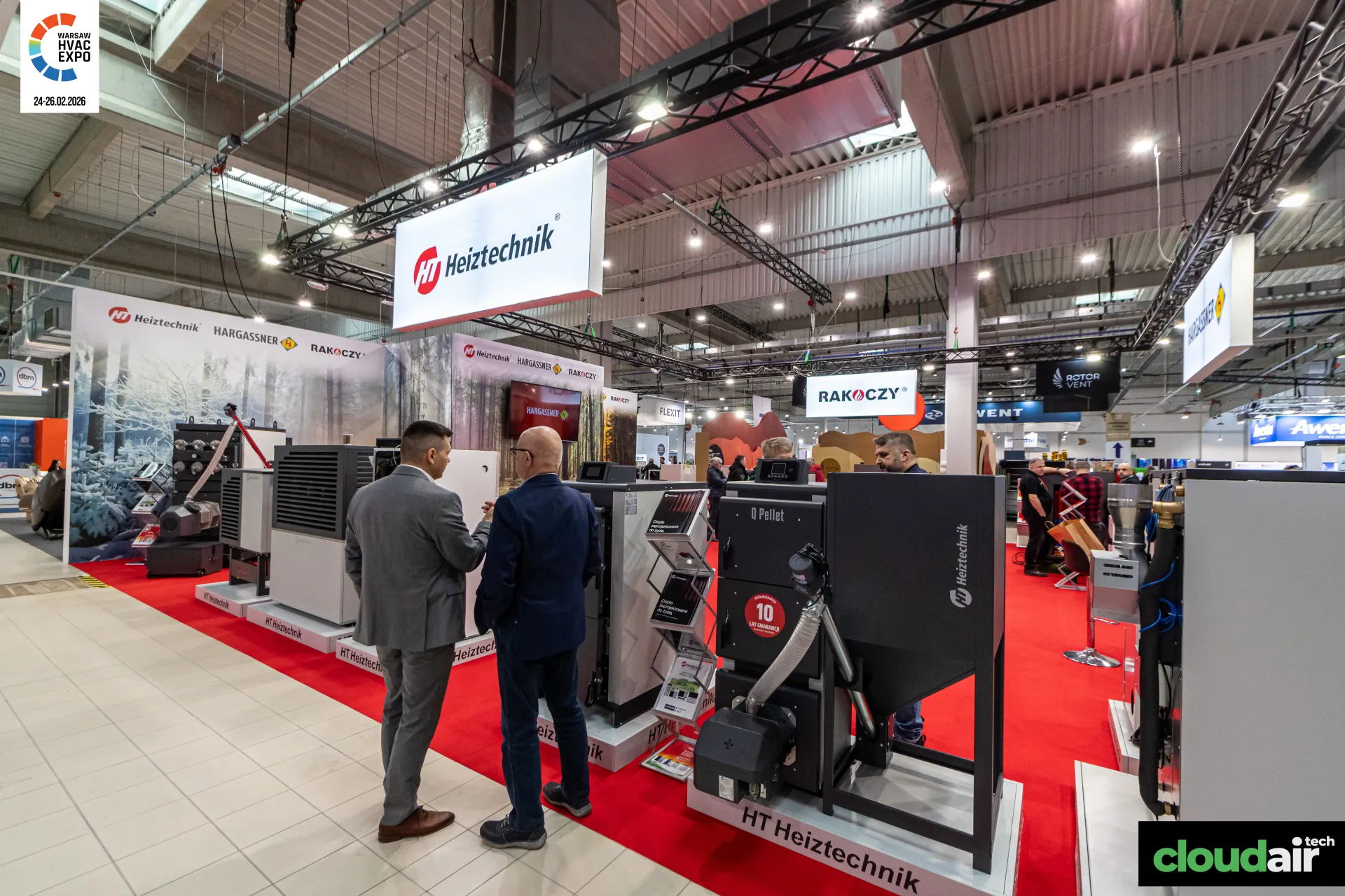 Heiztechnik Q Pellet boiler and heat pump line-up beside the aisle at Warsaw HVAC Expo 2026