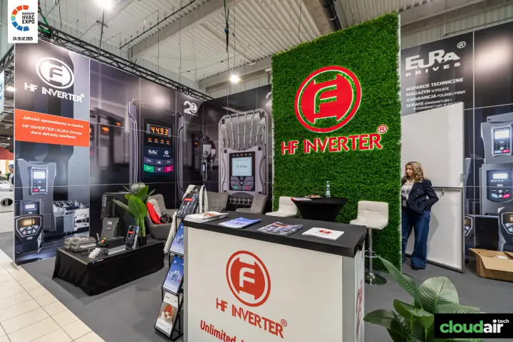 HF Inverter reception counter beside the green logo wall at Warsaw HVAC Expo 2026