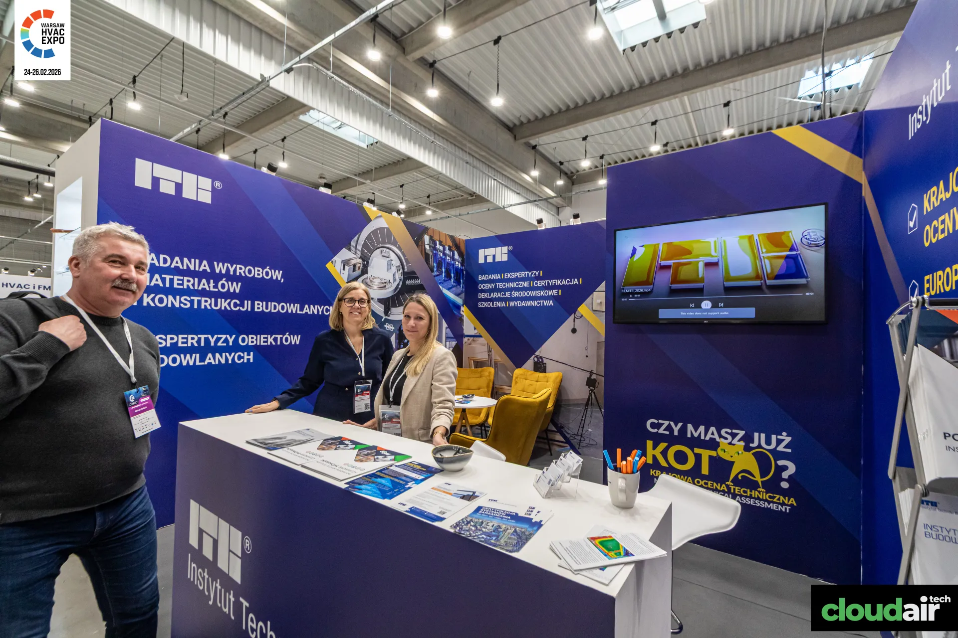ITB counter with brochures and screen showing a thermal-image logo at Warsaw HVAC Expo 2026