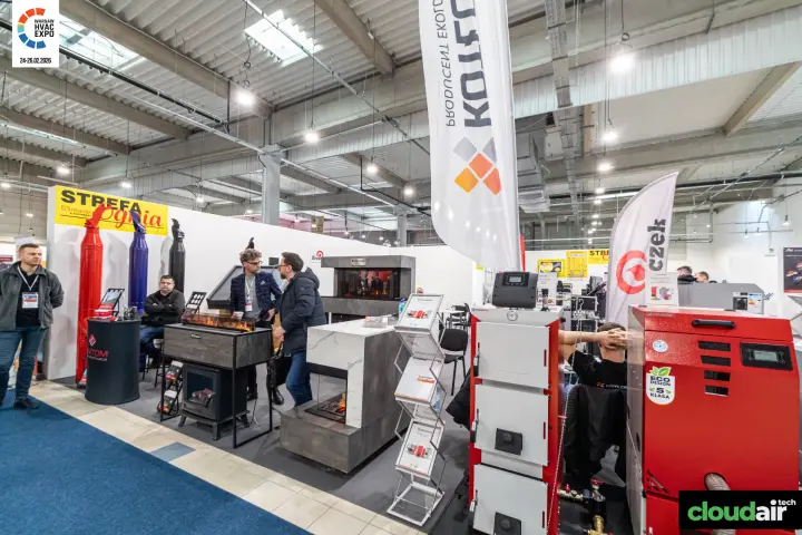 Kotłospaw boilers in front of the Strefa Ognia fireplace zone at Warsaw HVAC Expo 2026