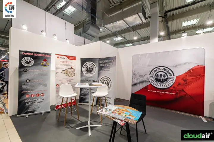 Krajowa Izba Kominiarzy stand with chimney safety roll-up banners at Warsaw HVAC Expo 2026