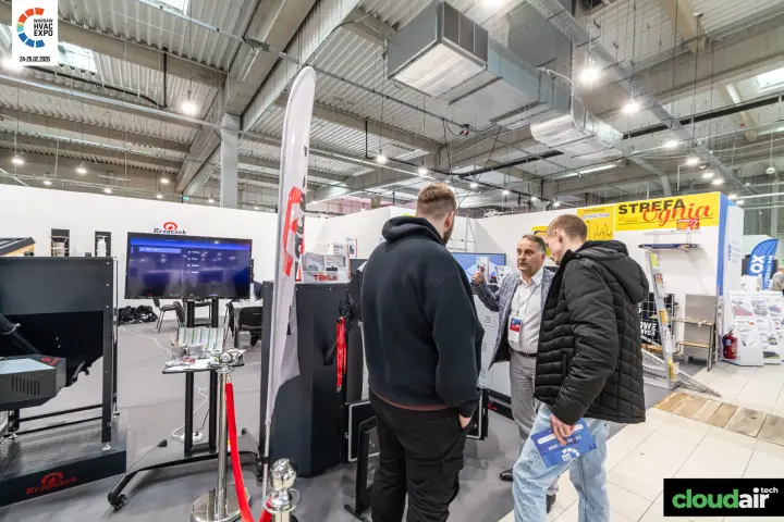 Krzaczek stand with black boilers, Tekla brochures and rope barrier