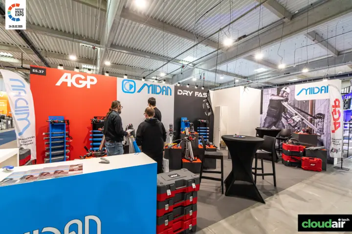 Midan and AGP stand with core drilling rigs and stacked red tool cases at Warsaw HVAC Expo 2026