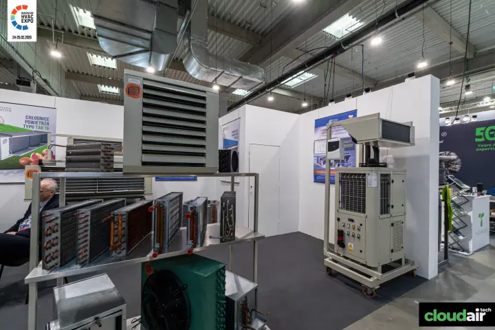 Mobile cooling unit on wheels beside a rack of finned coils