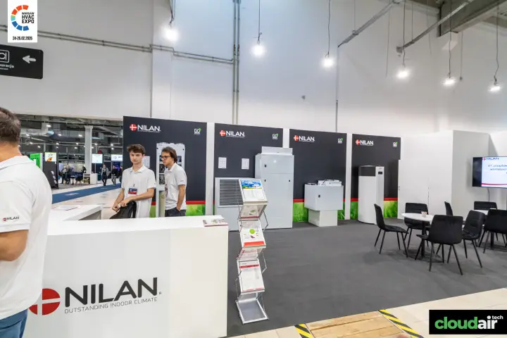 Nilan stand with heat recovery ventilation units and heat pump on black walls