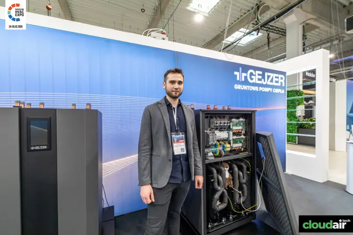 Opened Gejzer heat pump showing its control board and insulated pipework
