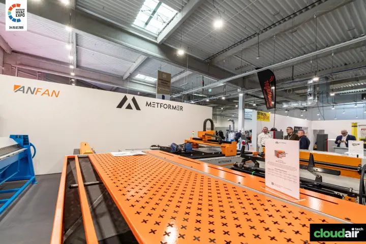Perforated orange worktable of a Metformer machine with spec card