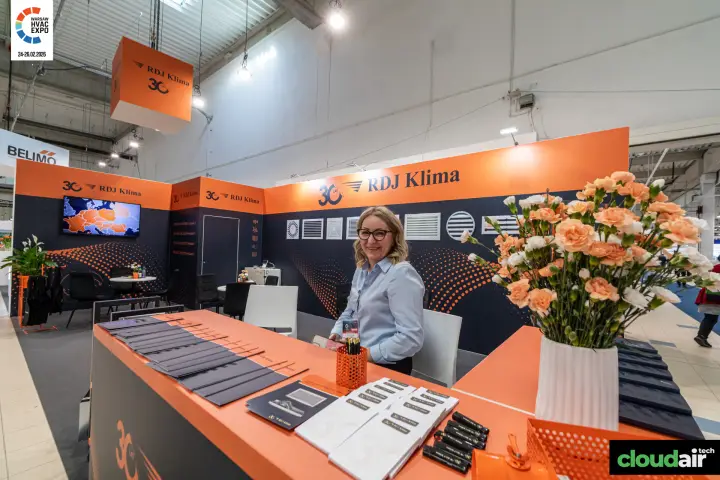 RDJ Klima reception counter under the hanging 30-year logo at Warsaw HVAC Expo 2026
