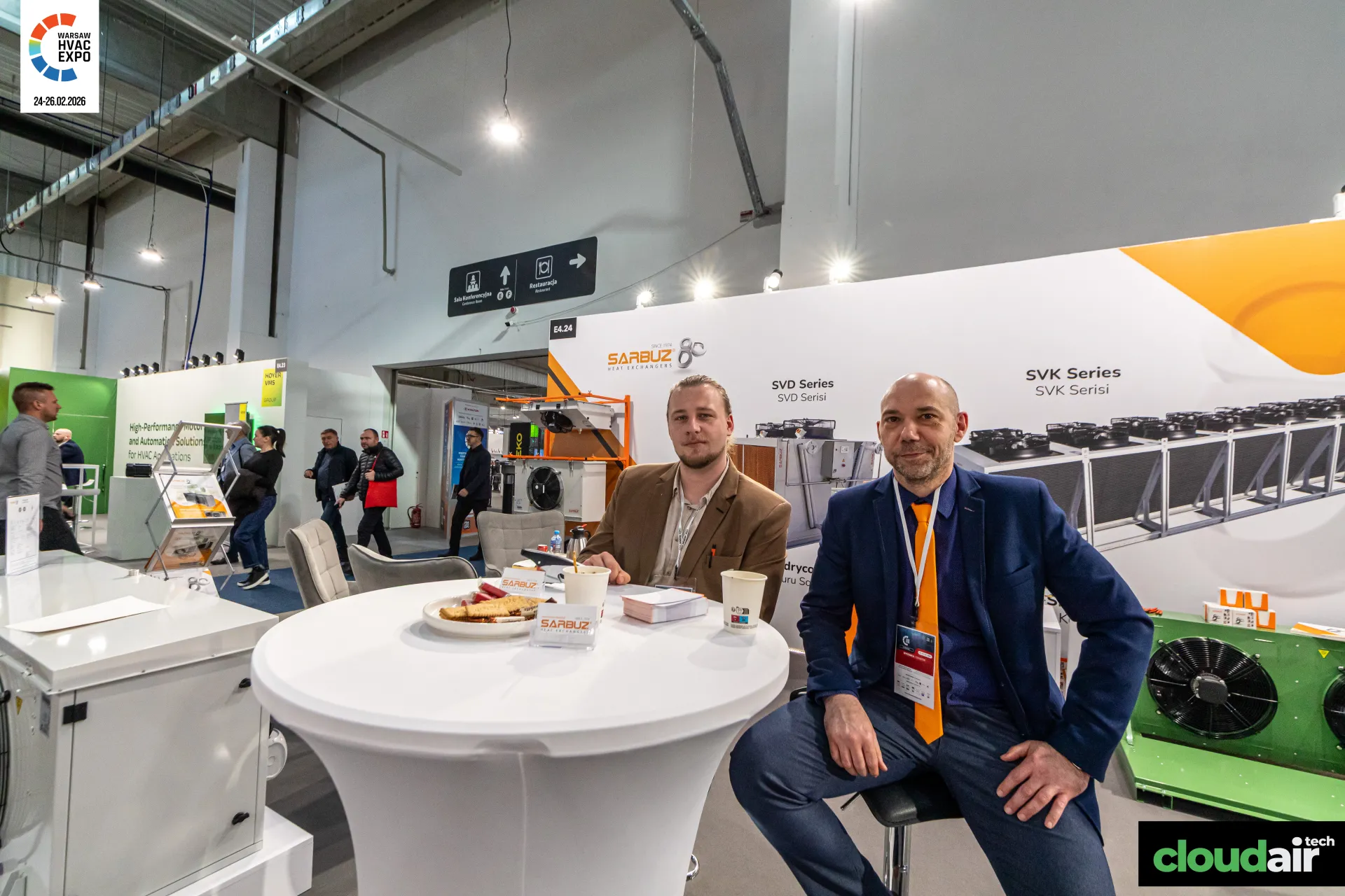Sarbuz meeting table in front of SVD and SVK Series wall graphics at Warsaw HVAC Expo 2026