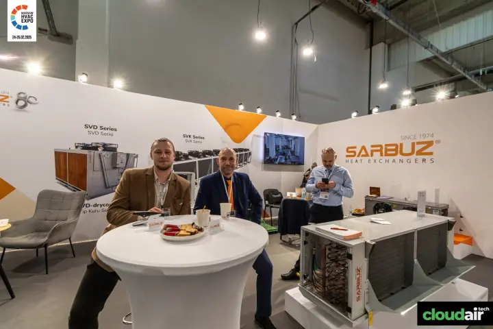 Sarbuz table area beside an opened unit with exposed copper piping