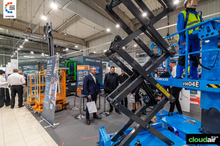 Sinoboom VM04E mast lift in front of the Multi AWP stand at Warsaw HVAC Expo 2026