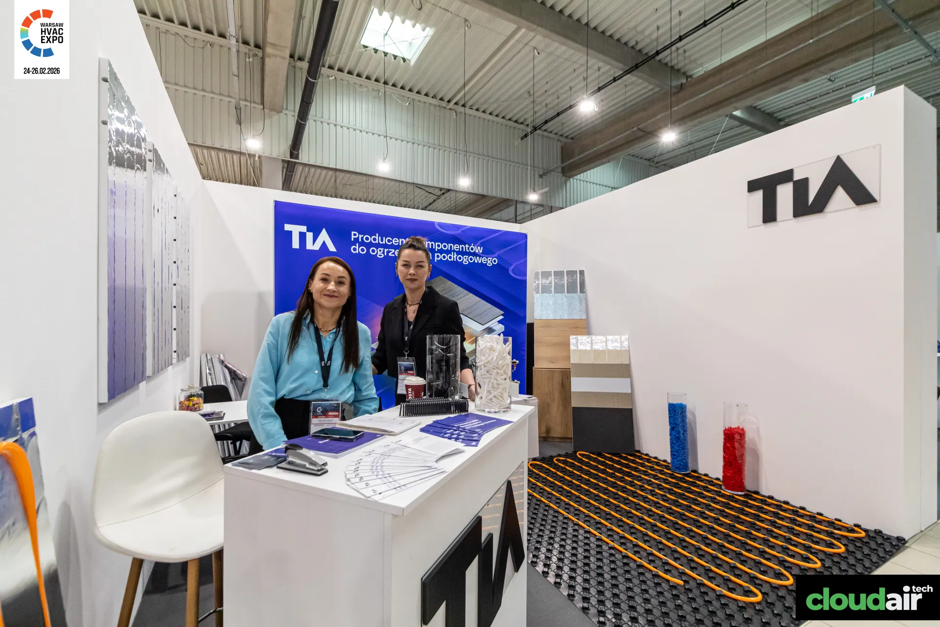TIA reception counter with brochures and underfloor heating mat at Warsaw HVAC Expo 2026