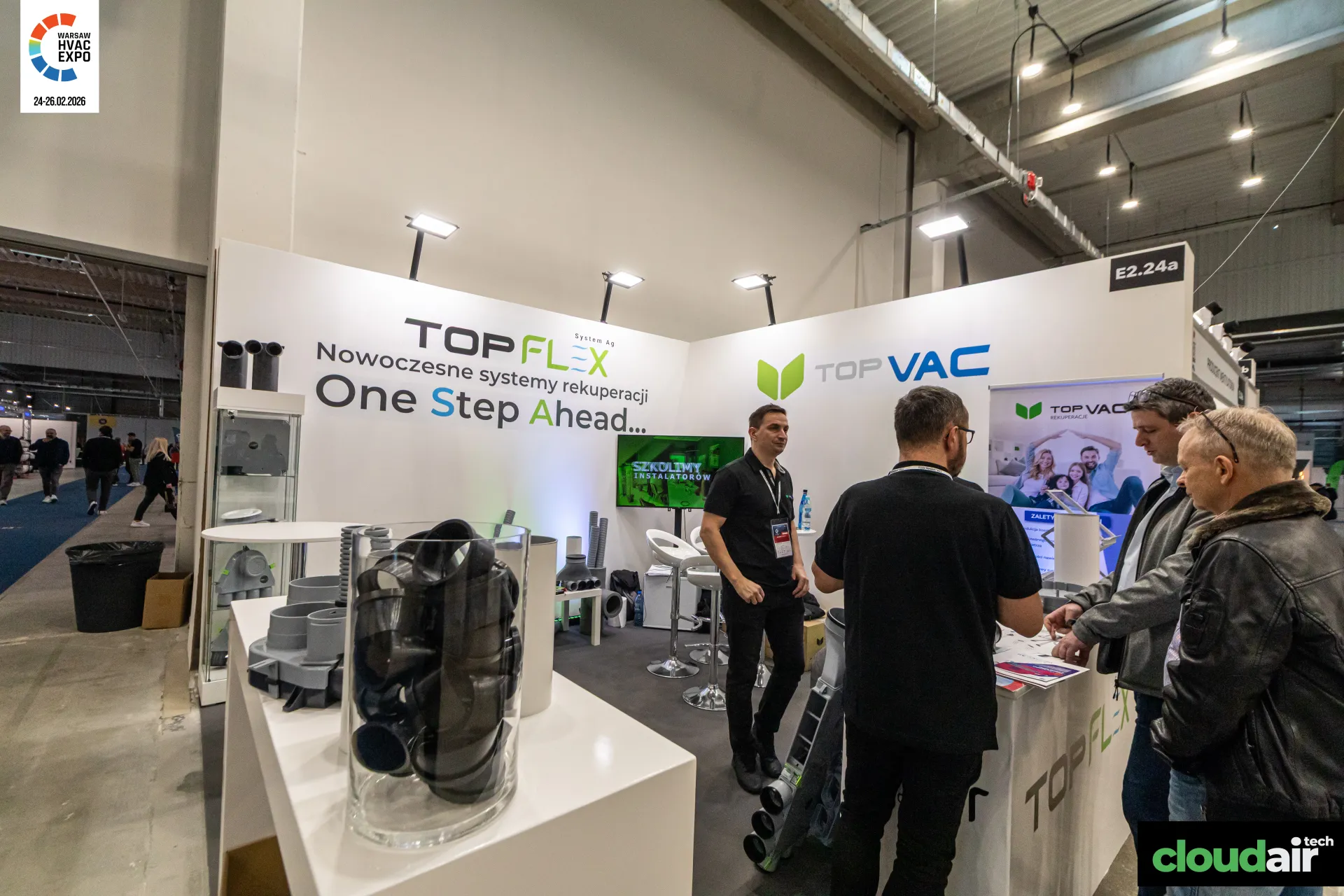 Topflex and Top Vac stand with plastic ventilation duct fittings at Warsaw HVAC Expo 2026