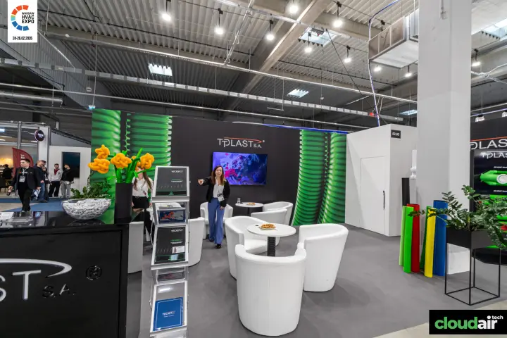 Tplast lounge with white armchairs and green corrugated pipe graphics