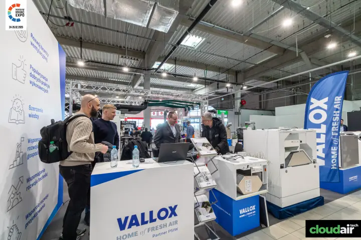 Vallox counter and feather flag beside the PSIW mission wall at Warsaw HVAC Expo 2026
