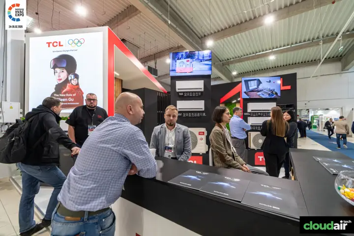 Visitors at the TCL counter with split units on the back walls at Warsaw HVAC Expo 2026