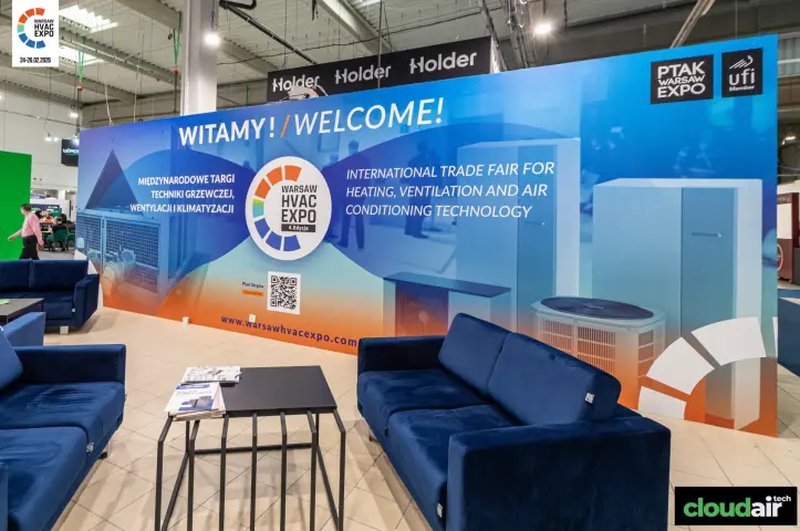Warsaw HVAC Expo welcome wall with navy lounge sofas
