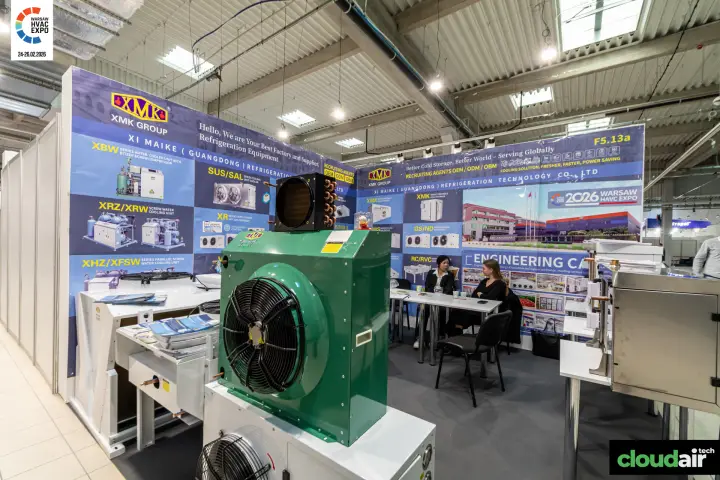 XMK Group stand with a green condensing unit and refrigeration product boards