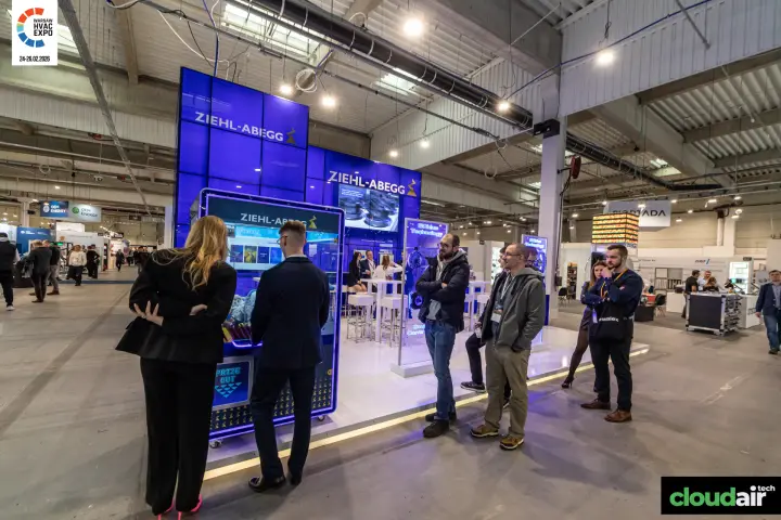 Ziehl-Abegg glowing blue stand with a branded prize claw machine at Warsaw HVAC Expo 2026